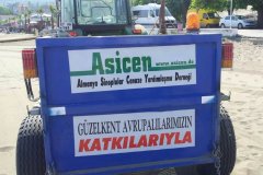 ASİCEN Helaldı'ya kum temizleme makinası bağışladı